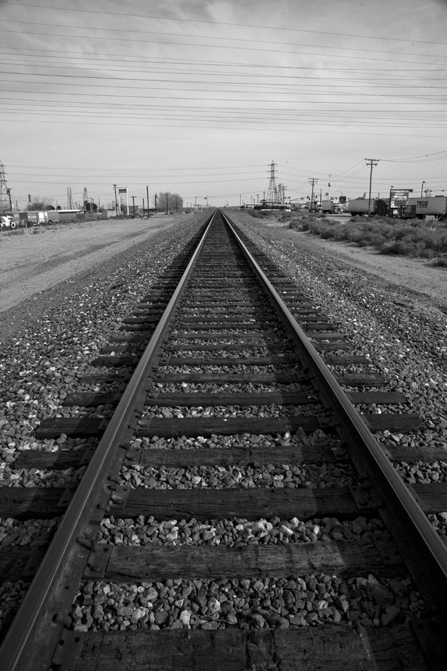 Railroad Tracks and Telephone Wires - Text and Image PhotographyText 